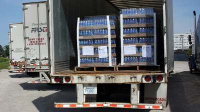 Cases of bottled water loaded on a truck