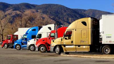 Several semi trucks parked together
