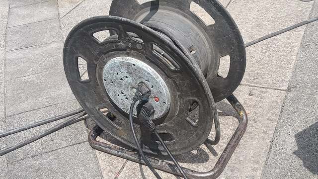 A reel of extension cord, not a tap on the refrigeration unit