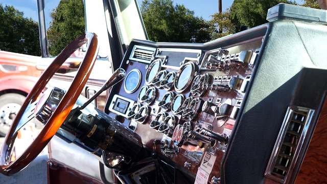 The dashboard of a Freightliner Cascadia. A reading light has to stay off that glass