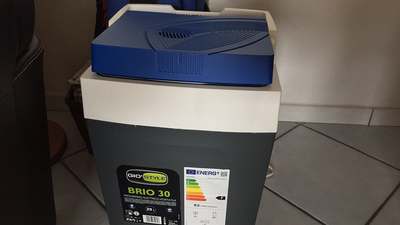 A Gio Style Brio portable compressor fridge with the lid closed