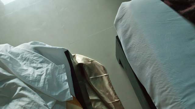 A made hotel bed. A bunk wants that kind of darkness, and this photo is not a sleeper curtain