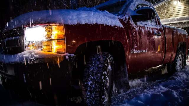 A red truck in the snow