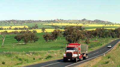 A truck on a rural highway, the trip a plan has to fit around