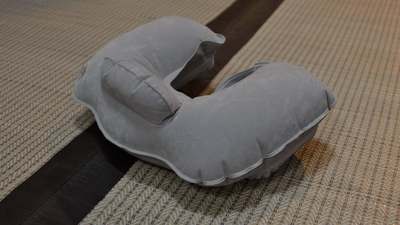 A U-shaped travel pillow on a white background